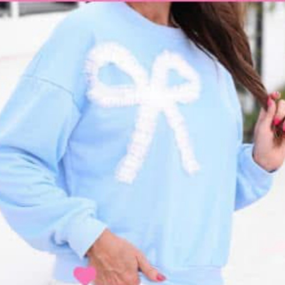 Light Blue Sweatshirt with White Bow